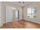 Bedroom with wood floors, a ceiling fan, and french doors at 3353 E Nolan Dr, Chandler, AZ 85249