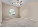 Bedroom featuring carpet floors, a fan, and a window with blinds at 3353 E Nolan Dr, Chandler, AZ 85249
