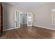 Bedroom with hardwood floors, a window with blinds, and french doors at 3353 E Nolan Dr, Chandler, AZ 85249