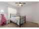 Charming bedroom featuring a brass bed, sheer curtains, and cozy decor at 3353 E Nolan Dr, Chandler, AZ 85249