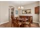 Dining room with a wood table, upholstered chairs and an antique buffet at 3353 E Nolan Dr, Chandler, AZ 85249