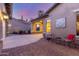 Inviting exterior features include a porte cochere, brick accents, and desert landscaping at 3353 E Nolan Dr, Chandler, AZ 85249