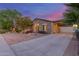 Charming single-Gathering home with a desert landscape, stone accents, a welcoming entryway, and a spacious three-car garage at 3353 E Nolan Dr, Chandler, AZ 85249