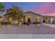 Charming single-story home featuring a stone facade and a well-manicured front yard with desert landscaping at 3353 E Nolan Dr, Chandler, AZ 85249
