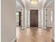 Grand foyer featuring tile flooring, a decorative front door, and sidelights at 3353 E Nolan Dr, Chandler, AZ 85249