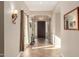 Inviting foyer with decorative lighting, tiled floor and dark wood front door creating an elegant entrance at 3353 E Nolan Dr, Chandler, AZ 85249