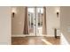Elegant foyer featuring double doors to the backyard, sconce lighting, and tile flooring at 3353 E Nolan Dr, Chandler, AZ 85249