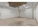 Spacious garage with ample storage space, overhead racks, and an automatic door opener at 3353 E Nolan Dr, Chandler, AZ 85249