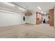 Well-lit garage with storage cabinets, sink, and ample space for vehicles and projects at 3353 E Nolan Dr, Chandler, AZ 85249