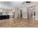 Open kitchen with stainless appliances, large island and adjacent space with wine coolers at 3353 E Nolan Dr, Chandler, AZ 85249
