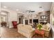 Cozy living room featuring a stone fireplace, comfortable seating, and neutral decor, creating a welcoming atmosphere at 3353 E Nolan Dr, Chandler, AZ 85249