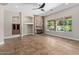 Spacious living room with stone fireplace, large windows with a view of the pool and built-in shelving at 3353 E Nolan Dr, Chandler, AZ 85249