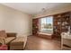 Office space with a comfortable sofa, desk, and built-in shelving at 3353 E Nolan Dr, Chandler, AZ 85249