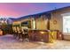 Charming backyard bar area, perfect for outdoor entertaining with comfortable seating and tasteful decor at 3353 E Nolan Dr, Chandler, AZ 85249