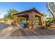 Community pavilion area with green trash receptacles, BBQ, desert landscaping, and bench seating for residents at 3353 E Nolan Dr, Chandler, AZ 85249