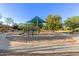 A community playground with a covered play structure, climbing equipment, and benches for relaxing at 3353 E Nolan Dr, Chandler, AZ 85249