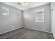 Neutral bedroom features carpet, a ceiling fan, and natural light from three windows at 3471 E Azalea Dr, Gilbert, AZ 85298