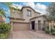 Charming two-story home with desert landscaping, a two-car garage, and stone accents at 3471 E Azalea Dr, Gilbert, AZ 85298