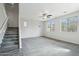 Spacious living room with large windows, a ceiling fan, and neutral carpeting at 3471 E Azalea Dr, Gilbert, AZ 85298