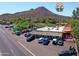 Aerial view of a local business with parking, street view, and mountain views in the background at 37801 N Cave Creek Rd # 11, Cave Creek, AZ 85331