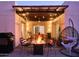 Cozy outdoor patio with fire pit, swing chair, and string lights, ideal for relaxing evenings at 37801 N Cave Creek Rd # 11, Cave Creek, AZ 85331