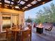 Inviting outdoor patio with dining area, fire pit, and comfortable seating, perfect for entertaining at 37801 N Cave Creek Rd # 11, Cave Creek, AZ 85331