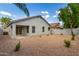 Backyard featuring desert landscaping, providing a serene and low-maintenance outdoor space at 3847 W Yellow Peak Dr, San Tan Valley, AZ 85144