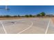 Outdoor basketball court offers recreation with trees and blue sky in a Gathering community at 3847 W Yellow Peak Dr, San Tan Valley, AZ 85144