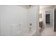 The bathroom has a tub and shower combination, a wooden vanity and tile flooring at 3847 W Yellow Peak Dr, San Tan Valley, AZ 85144