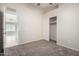 The bedroom has carpet and a sliding door closet with a shelf and hanging rod at 3847 W Yellow Peak Dr, San Tan Valley, AZ 85144
