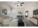 The main bedroom boasts ample natural light, a comfortable sitting area, and stylish decor at 3847 W Yellow Peak Dr, San Tan Valley, AZ 85144