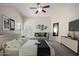The main bedroom boasts ample natural light, a comfortable sitting area, and stylish decor at 3847 W Yellow Peak Dr, San Tan Valley, AZ 85144