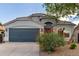 Charming single-story home with a two-car garage and a well-manicured front yard with desert landscaping at 3847 W Yellow Peak Dr, San Tan Valley, AZ 85144