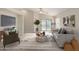 Bright living room features neutral tones, vaulted ceilings, and a cozy seating arrangement at 3847 W Yellow Peak Dr, San Tan Valley, AZ 85144