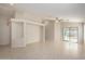 Open living area with tile flooring and sliding glass door providing natural light at 3847 W Yellow Peak Dr, San Tan Valley, AZ 85144