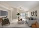 Bright living room features neutral tones, vaulted ceilings, and sliding glass doors for indoor/outdoor living at 3847 W Yellow Peak Dr, San Tan Valley, AZ 85144