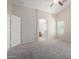 Light-filled main bedroom offering neutral walls, plush carpeting and easy access to the ensuite at 3847 W Yellow Peak Dr, San Tan Valley, AZ 85144