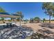 Playground and picnic tables in community park provide outdoor fun and shaded gathering spots at 3847 W Yellow Peak Dr, San Tan Valley, AZ 85144