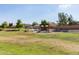 Community playground offers a fun area for children with shade structures and grassy fields at 3847 W Yellow Peak Dr, San Tan Valley, AZ 85144