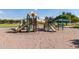 Community playground has slides and climbing for outdoor fun in a park setting at 3847 W Yellow Peak Dr, San Tan Valley, AZ 85144