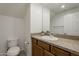 Bathroom featuring a single sink vanity with granite countertops and ample lighting at 3935 E Rough Rider Rd # 1264, Phoenix, AZ 85050
