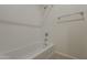 Bathroom featuring white tiling and a bathtub with shower at 3935 E Rough Rider Rd # 1264, Phoenix, AZ 85050