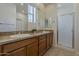 Bathroom featuring double sinks, granite counters, and a walk-in shower at 3935 E Rough Rider Rd # 1264, Phoenix, AZ 85050