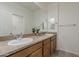 Bathroom featuring double sinks, granite counters, and a plant at 3935 E Rough Rider Rd # 1264, Phoenix, AZ 85050