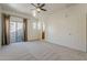 Spacious bedroom with carpet, sliding glass doors, and neutral walls at 3935 E Rough Rider Rd # 1264, Phoenix, AZ 85050