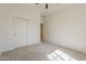 Bedroom featuring neutral carpet, double closet, and a ceiling fan at 3935 E Rough Rider Rd # 1264, Phoenix, AZ 85050