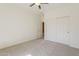 Bedroom featuring neutral carpet, closet, and a ceiling fan at 3935 E Rough Rider Rd # 1264, Phoenix, AZ 85050