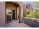 Covered entryway with sliding door provides private access to the home's interior at 3935 E Rough Rider Rd # 1264, Phoenix, AZ 85050
