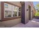 Exterior detail of the townhome with its colorful stucco and entryway wall lights at 3935 E Rough Rider Rd # 1264, Phoenix, AZ 85050