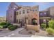Charming townhome featuring colorful stucco, gated front patio, and well-maintained desert landscaping at 3935 E Rough Rider Rd # 1264, Phoenix, AZ 85050